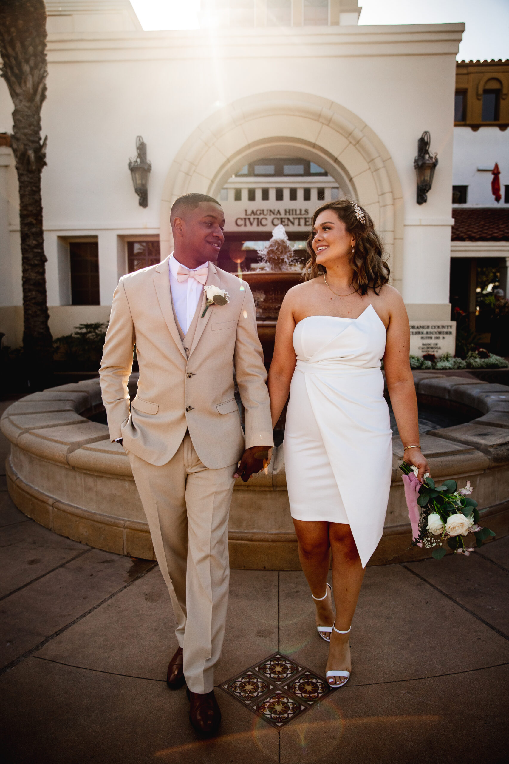 Interracial couple newly married at Laguna Hills Civic Courthouse after their civil wedding ceremony.